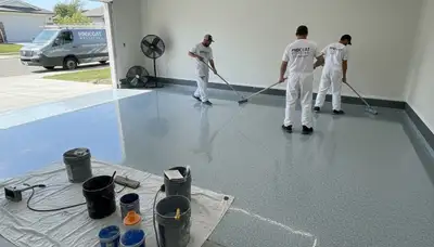 Epoxy garage floor coating in Kansas City, KS with durable, glossy finish applied by local painters
